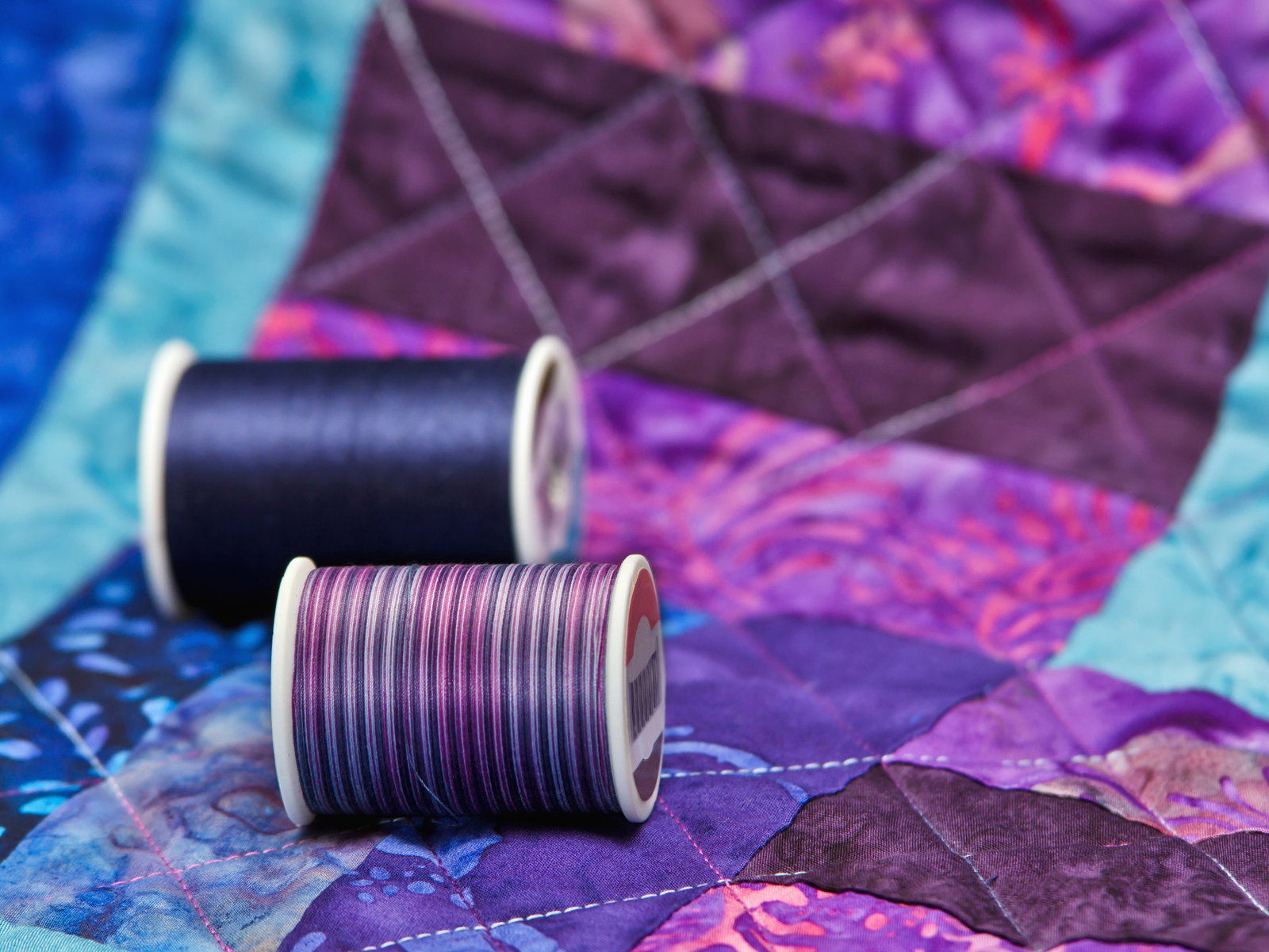 Thread and quilted fabric — craft in progress